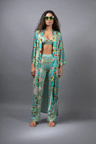 PSYCHEDELIC CROSSES AND STAR TEAL FLARED STRETCH PANTS
