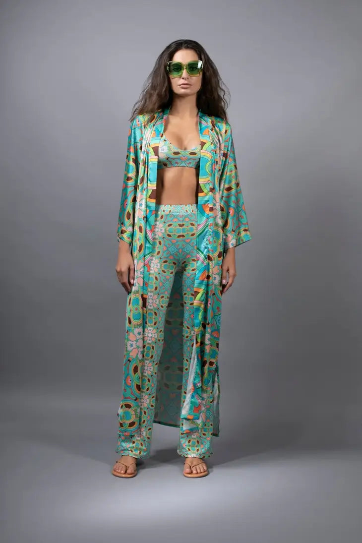 PSYCHEDELIC CROSSES AND STAR TEAL FLARED STRETCH PANTS