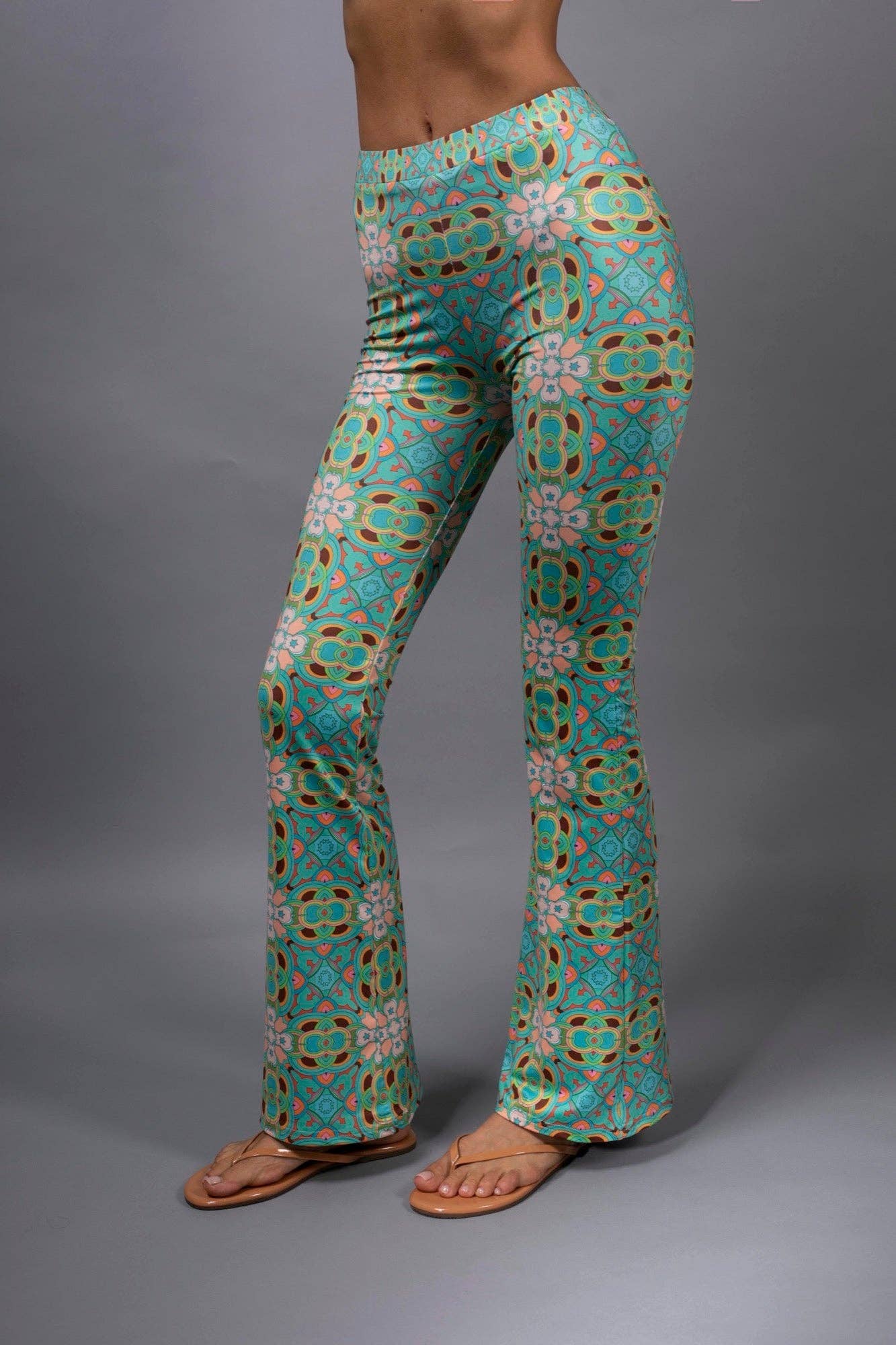 PSYCHEDELIC CROSSES AND STAR TEAL FLARED STRETCH PANTS