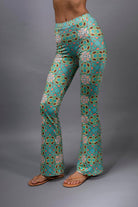 PSYCHEDELIC CROSSES AND STAR TEAL FLARED STRETCH PANTS