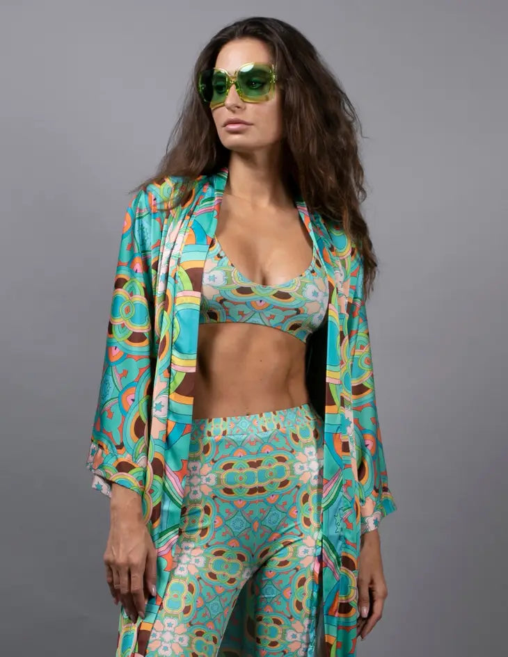 PSYCHEDELIC CROSSES AND STAR TEAL FLARED STRETCH PANTS