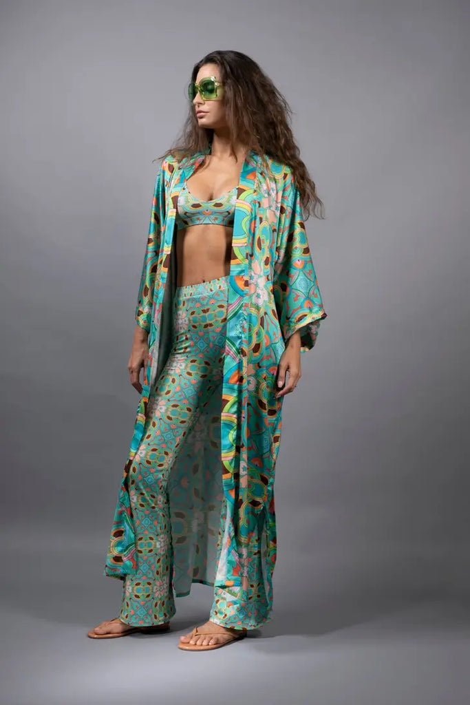 PSYCHEDELIC CROSSES AND STAR TEAL FLARED STRETCH PANTS
