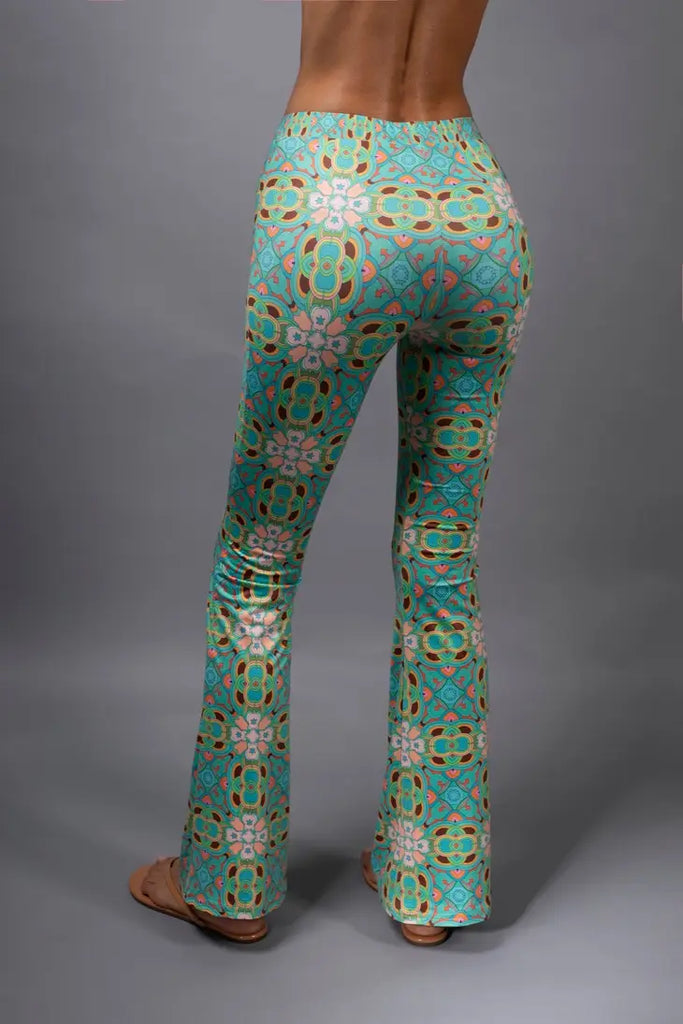 PSYCHEDELIC CROSSES AND STAR TEAL FLARED STRETCH PANTS