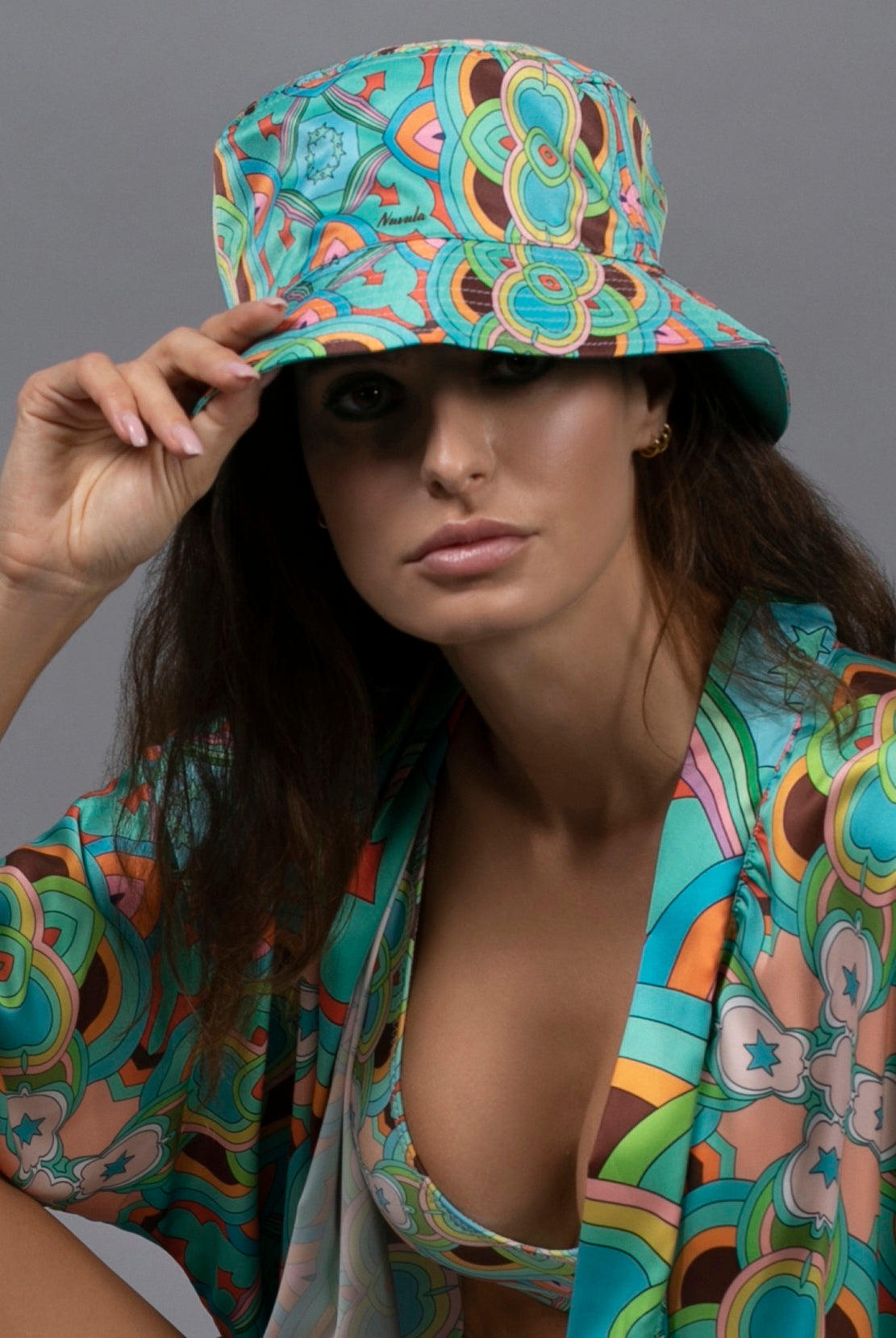 PSYCHEDELIC CROSSES AND STARS TEAL BUCKET HAT